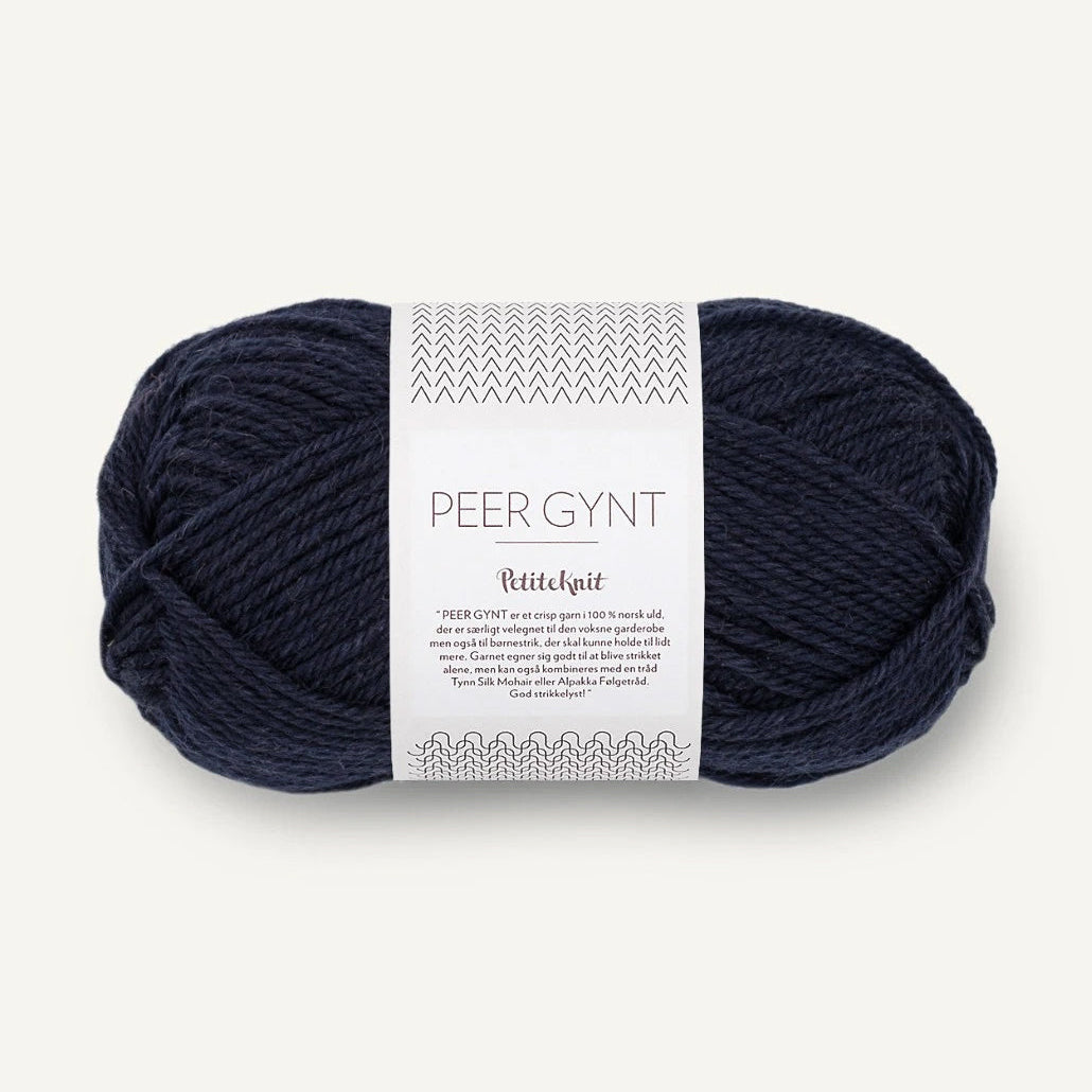 Navy skein of yarn Sandnes Garn with a label on a white background