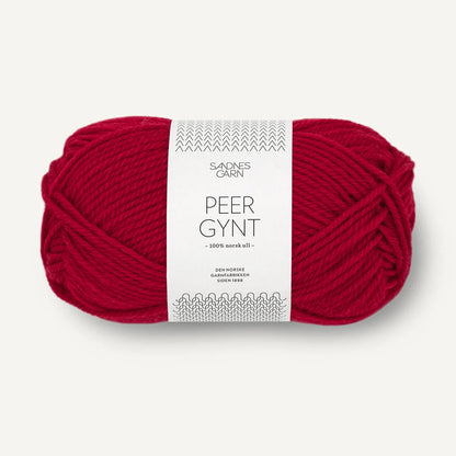Red skein of yarn with a label on a white background