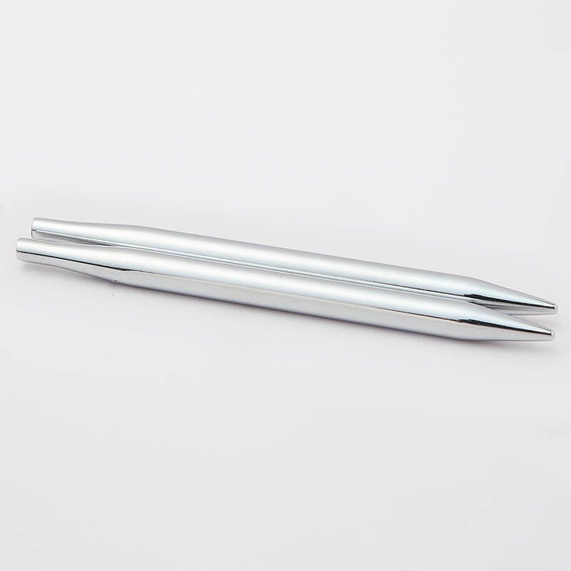 Two silver chopsticks on a white background
